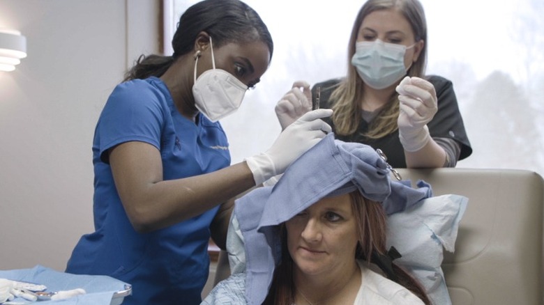 Dr. Mercy working on a patient