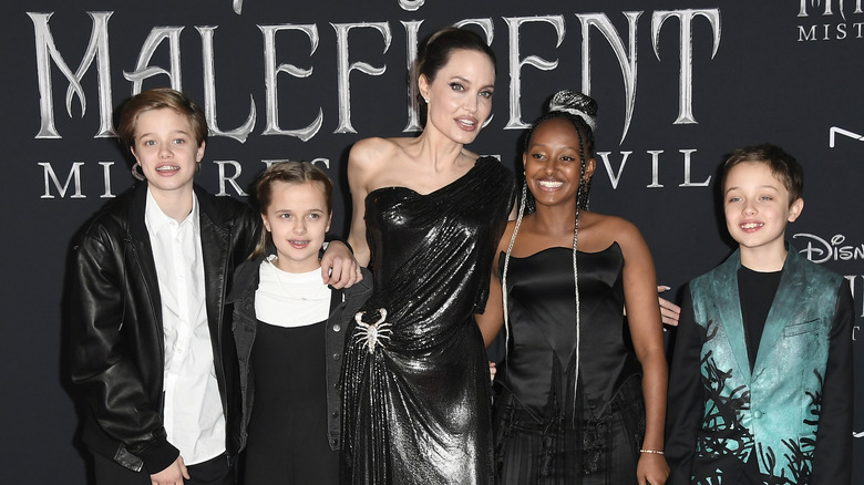 Angelina Jolie poses with children on red carpet for "Maleficent" film