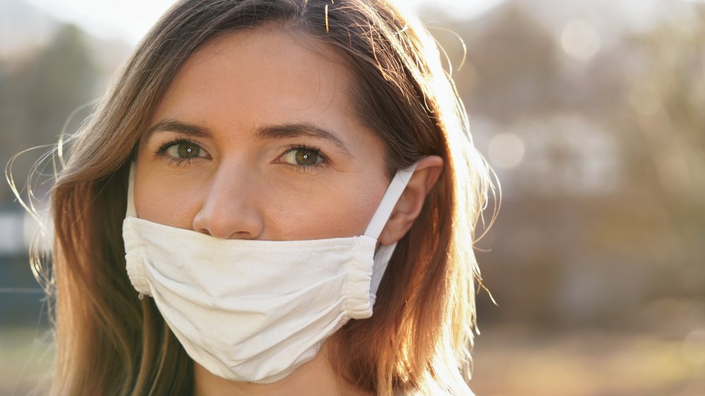 Woman wearing face mask incorrectly