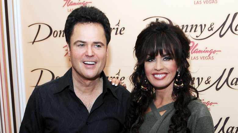 Donny and Marie Osmond posing 