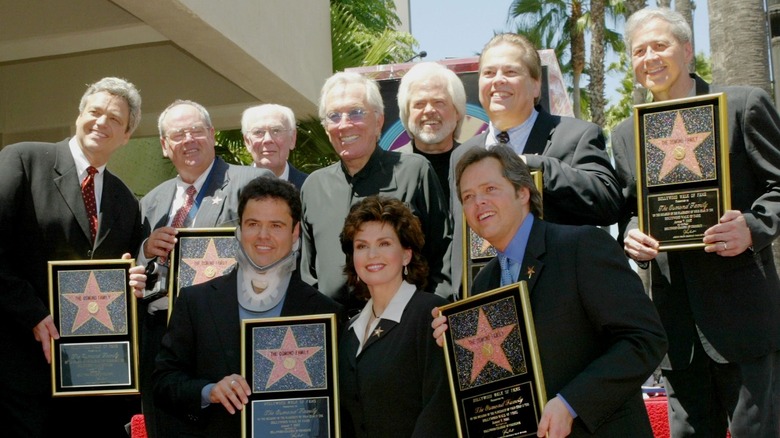 The Osmond family posing at the walk of fame