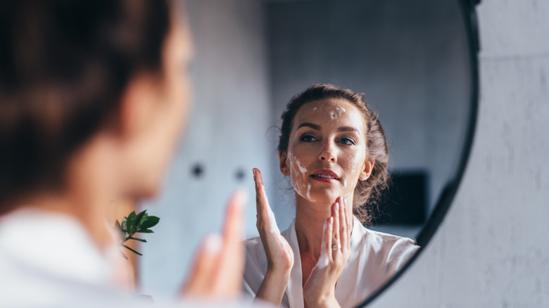 Woman washing face