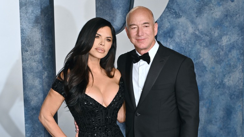 Jeff Bezos and Lauren Sanchez posing at a red carpet event