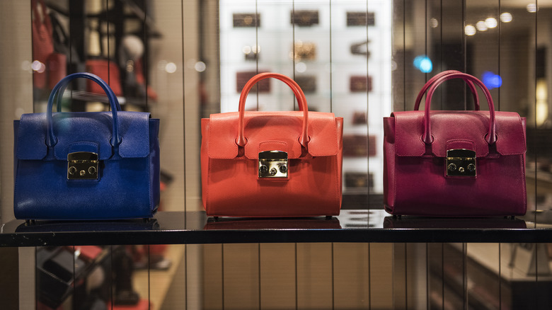 Designer bags on display in store