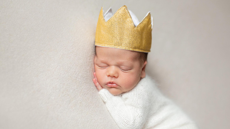 Baby boy wearing a crown