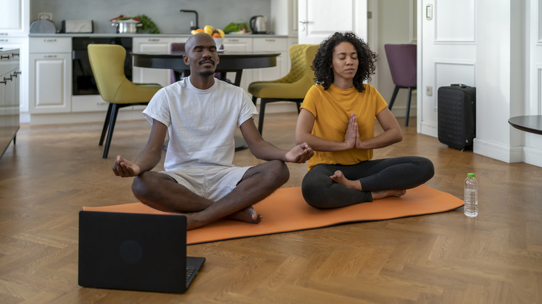 A couple meditating together