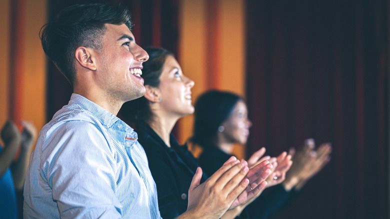 A happy audience clapping