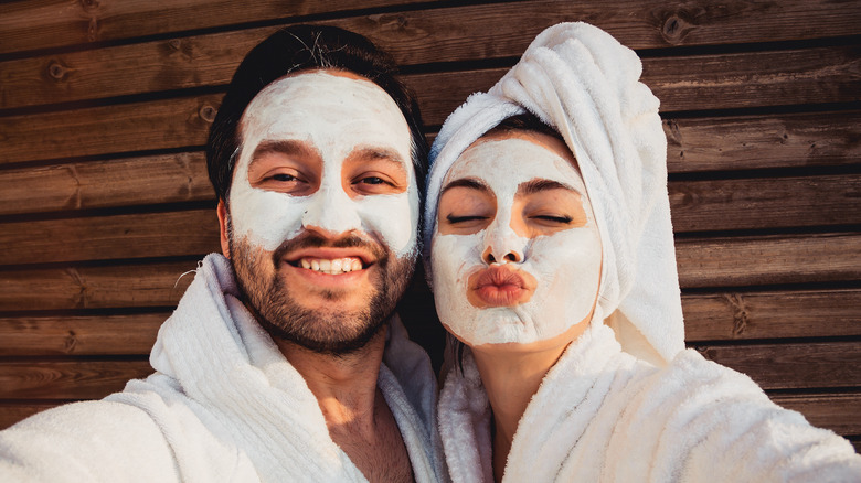 A couple posing in bathrobes