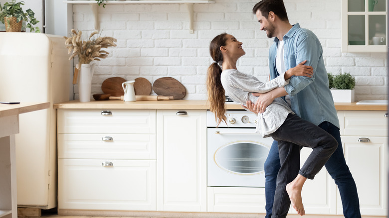 Couple dancing in kitchen