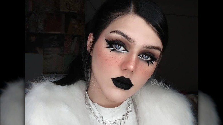 Woman wears black lipstick and winged eyeliner