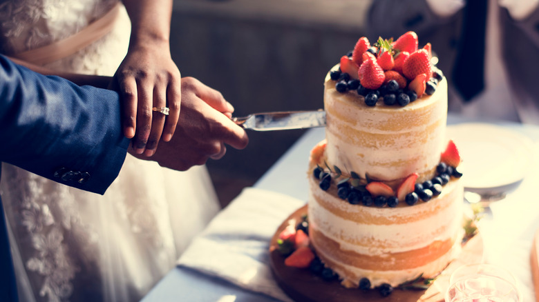 couple cutting their wedding cake