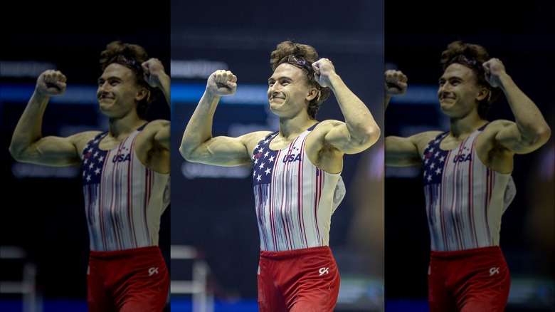 Stephen Nedoroscik smiles with hands in the air 