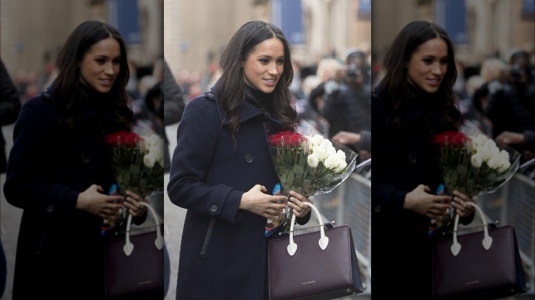 Meghan Markle carrying Strathberry bag
