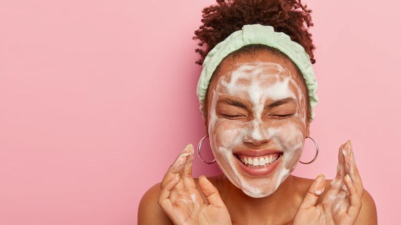 A woman washing her face