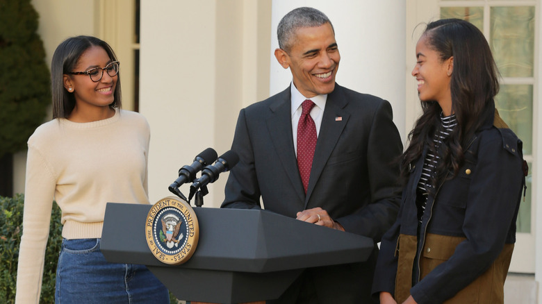 Malia and Sasha with their father President Barack Obama