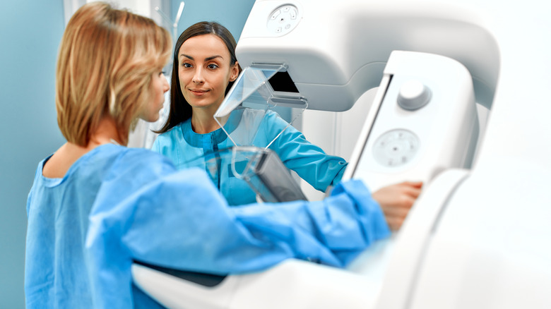 A woman getting a mammogram