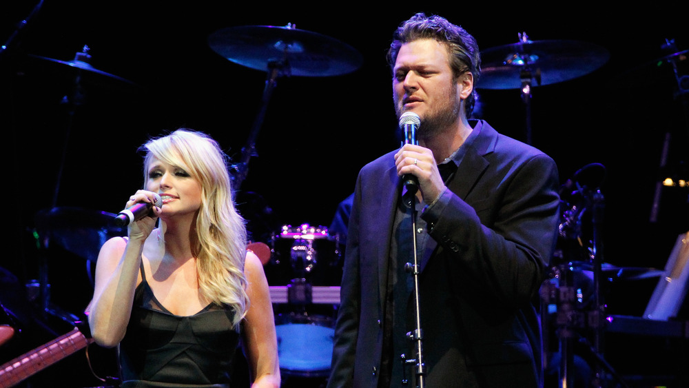 Miranda Lambert and Blake Shelton performing on stage