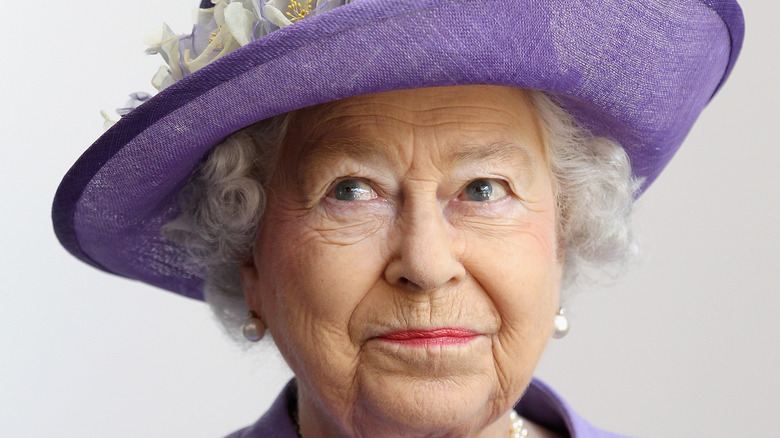 Queen Elizabeth II in a purple hat