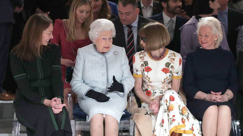 Queen with fashion greats and Angela Kelly