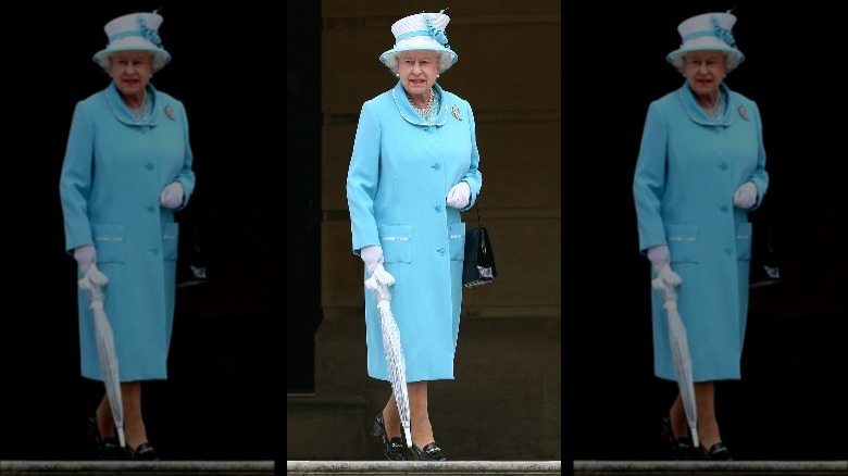 The Queen wearing turquoise coat dress