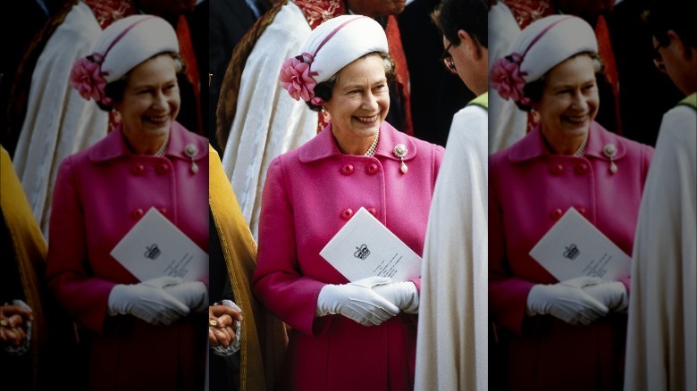 Queen in pink coat