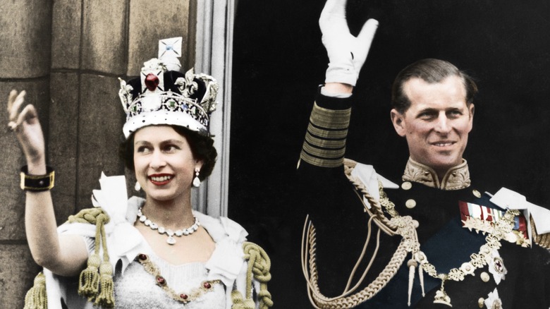 Queen Elizabeth and Prince Philip waving