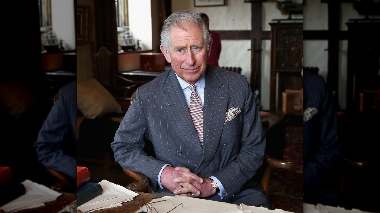 King Charles at a desk