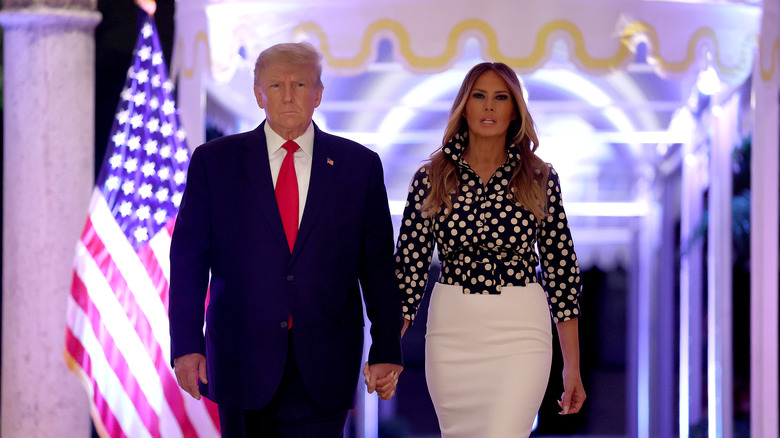 Donald and Melania Trump holding hands