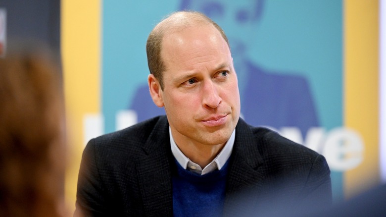 Prince William listening intently