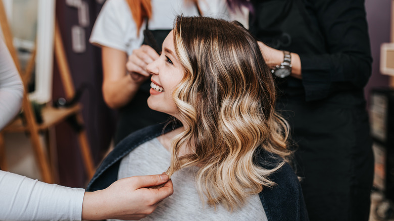 Woman gets salon color treatment