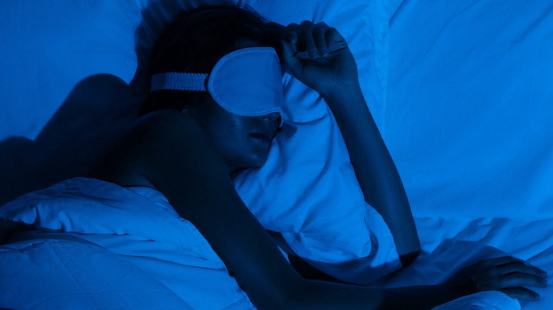 Woman sleeping with sleeping mask