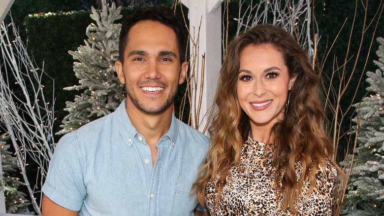 Carlos and Alexa PenaVega smiling 