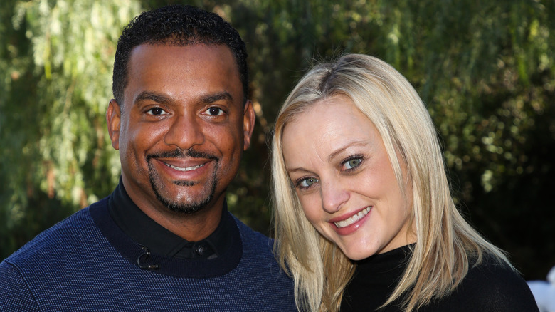 Alfonso Ribeiro smiling with his wife, Angela