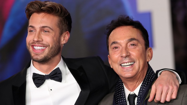 Jason Schanne smiling with his arm around Bruno Tonioli