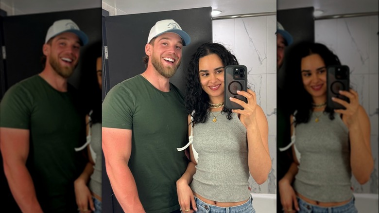 Steve Bean and Marianly Tejada taking a selfie together in a bathroom