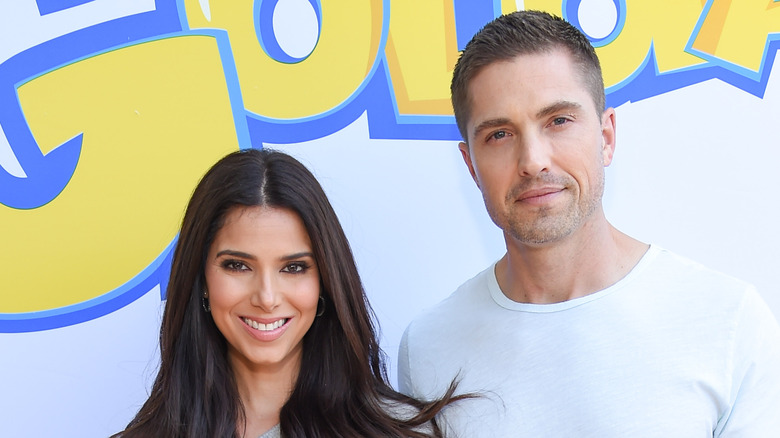 Eric Winter and Roselyn Sanchez posing at a press event