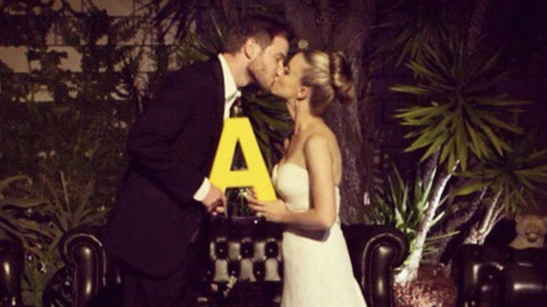 Shawn Ashmore kissing his wife at their wedding