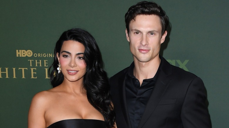 Arnas Fedaravičius and Emeraude Toubia posing at the White Lotus premiere