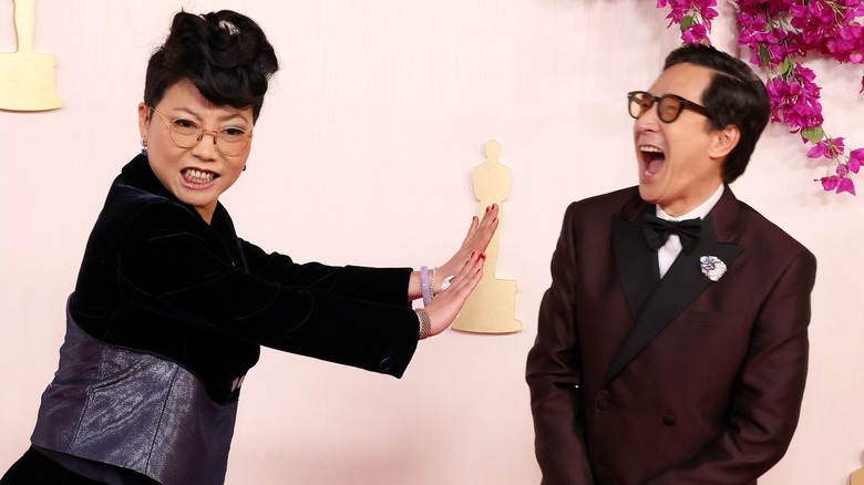 Echo Quan and a laughing Ke Huy Quan posing on the red carpet