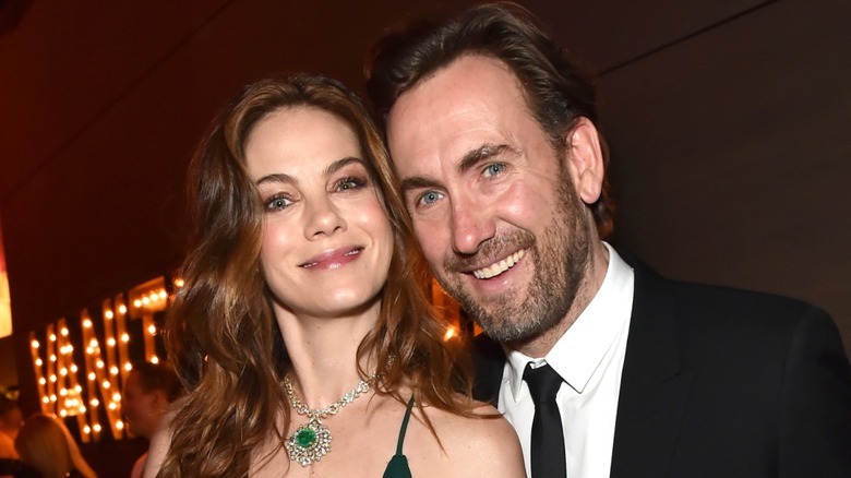 Michelle Monaghan and Peter White smiling at a Vanity Fair party