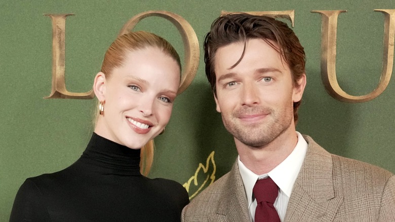 Abby Champion and Patrick Schwarzenegger smiling at the White Lotus premiere