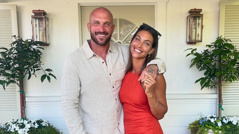 Mike Pyle and Lizzy Farag posing on a porch