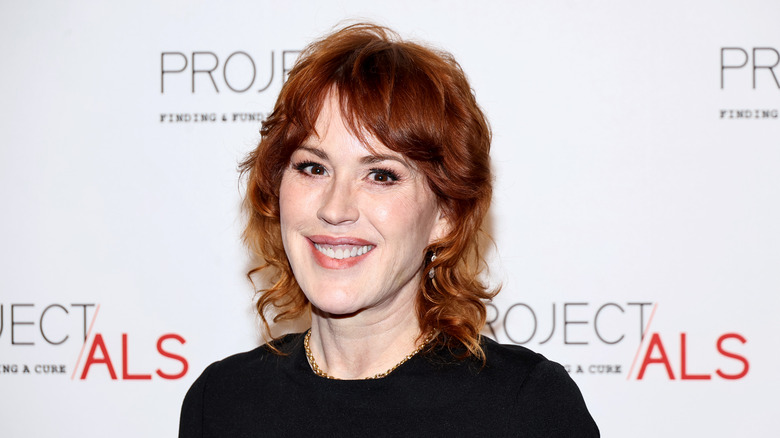 Molly Ringwald smiling at event