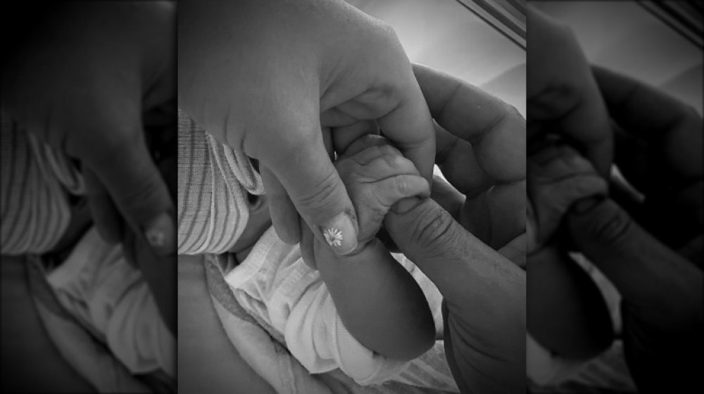 Black and white photo of Katy Perry and Orlando Bloom's newborn girl