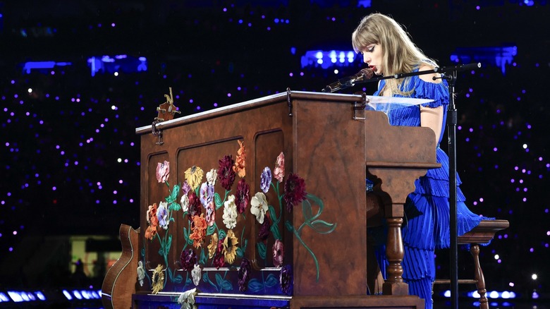 Taylor Swift singing playing piano