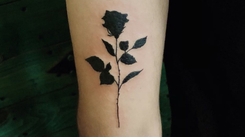 All black rose tattoo