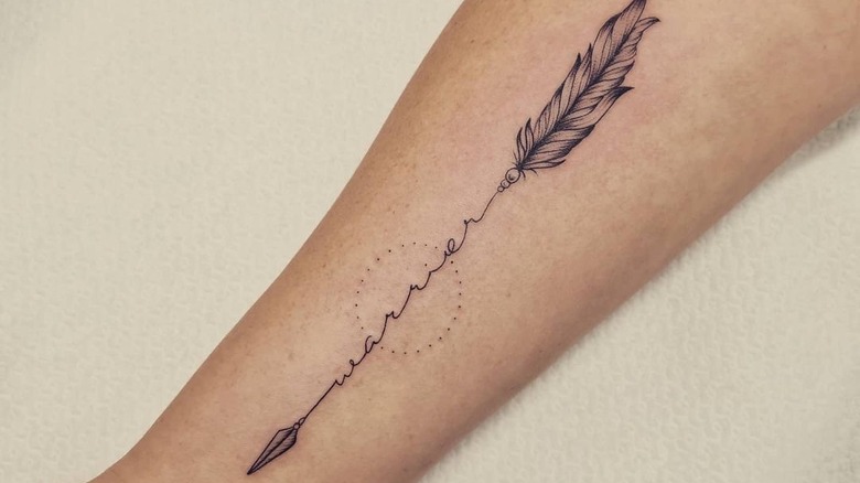 Arrow with feather warrior tattoo 