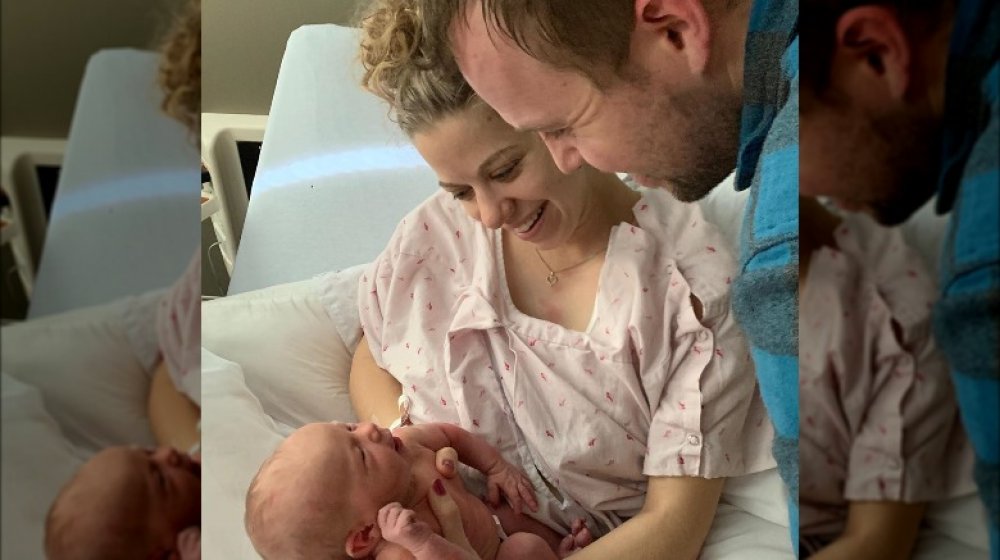 Abbie and John David Duggar with baby