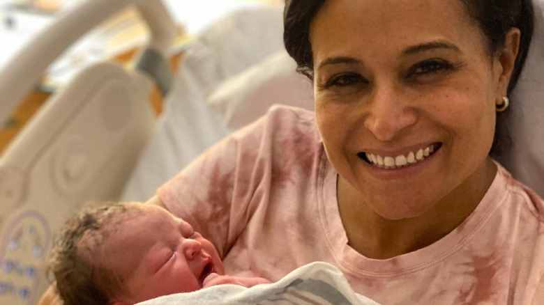 Kristen Welker holding newborn baby Margot