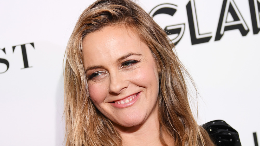 Alicia Silverstone smiles at an event